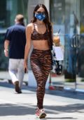 Eiza Gonzalez displays her amazing figure in animal print crop top and leggings while making a coffee run in Los Angeles