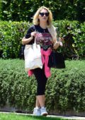 Holly Madison wears a vintage t-shirt and leggings while visiting a friend in West Hollywood, California