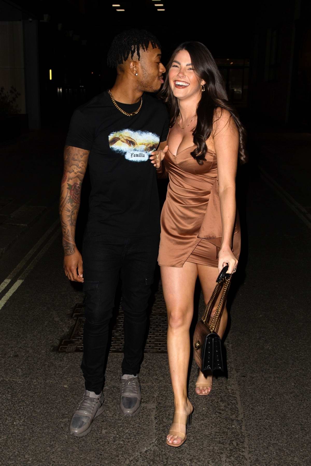 Rebecca Gormley and Biggs Chris are all smiles as they leave a friend's house in Newcastle, UK