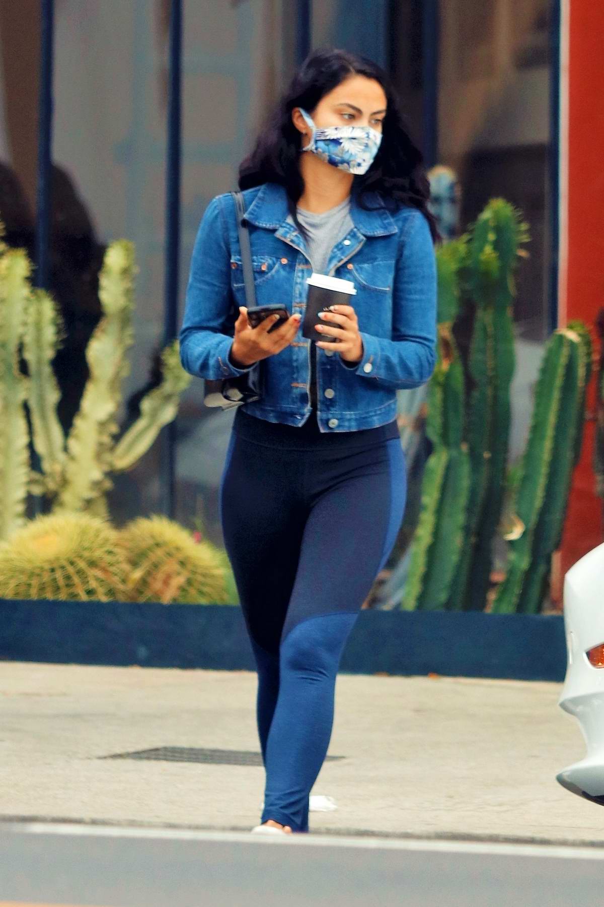 Camila Mendes Shows Off Her Toned Legs In Navy Leggings While Making A Coffee Run In Her Tesla