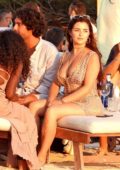 Demi Rose enjoys the sunset with friends at Experimental Beach in Formentera, Spain