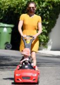 Kate Mara dons a cute summer yellow dress while taking her daughter out for a stroll in Los Feliz, California