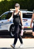Katherine Schwarzenegger shows her growing baby bump in a tank top and leggings while out for her walk with a friend in Santa Monica, California