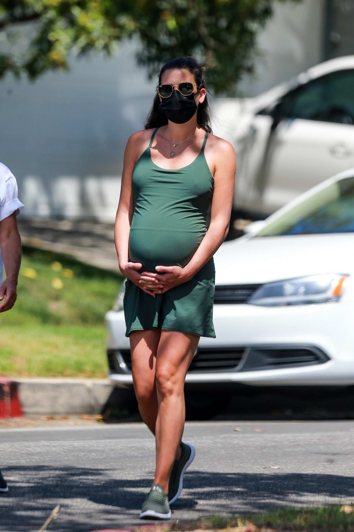 Lea Michele holds her growing belly while out on stroll with her mother ...