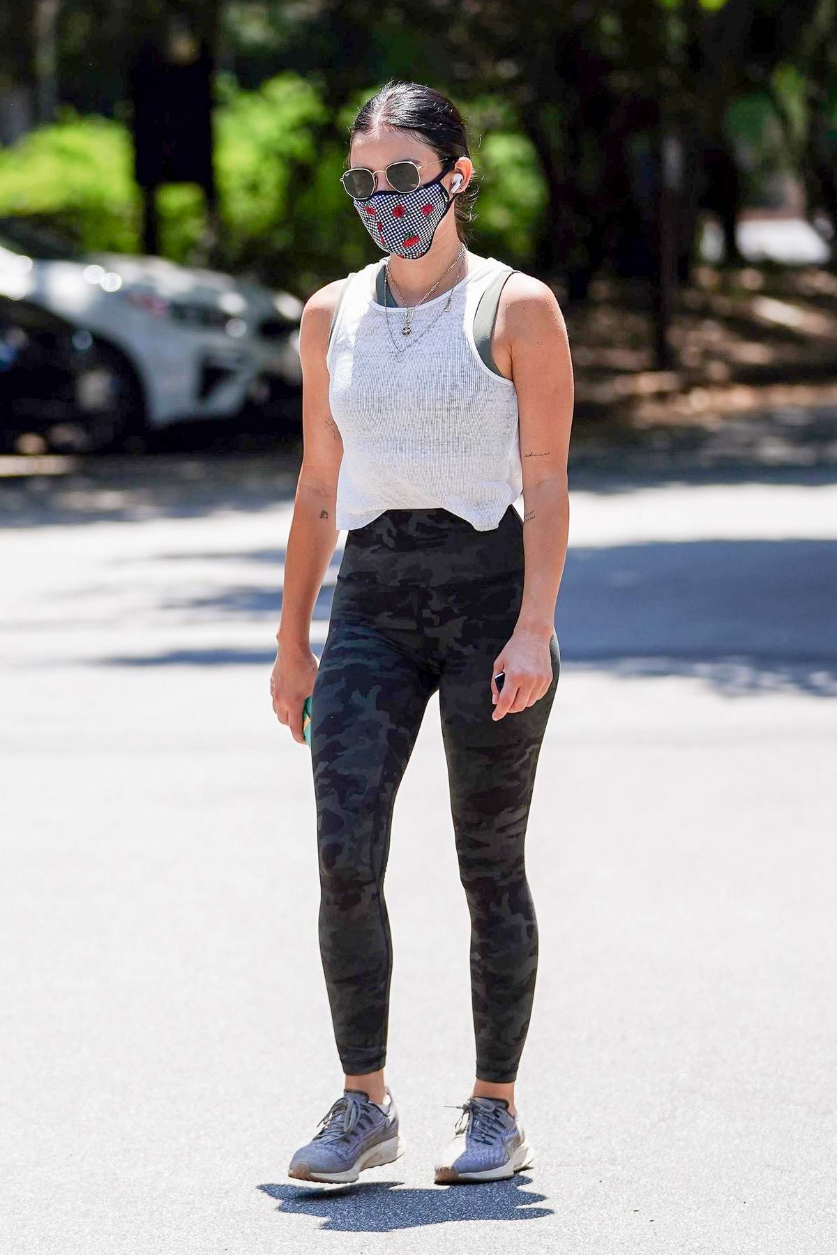 kendall jenner rocks a tank top and leggings while visiting a