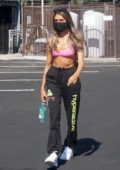 Madison Beer wears a pink sports bra and black sweatpants as she leaves a dance studio in West Hollywood, California