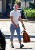 Olivia Wilde wears a casual white tee and blue leggings while running a few errands in Silver Lake, California
