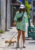 Vanessa Hudgens wears a green oversized tee while running errands with her dog in Los Feliz, California