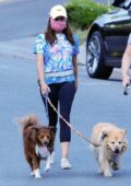 Aubrey Plaza wears tie-dye tee and black leggings as she takes her dogs out for a walk in Los Angeles