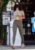 Eiza Gonzalez sports a beige top and green leggings while grabbing an iced Macha at Alfred's in Studio City, California