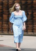 Elle Fanning looks pretty in blue summer dress as she stops by a florist shop with her mom in Los Angeles