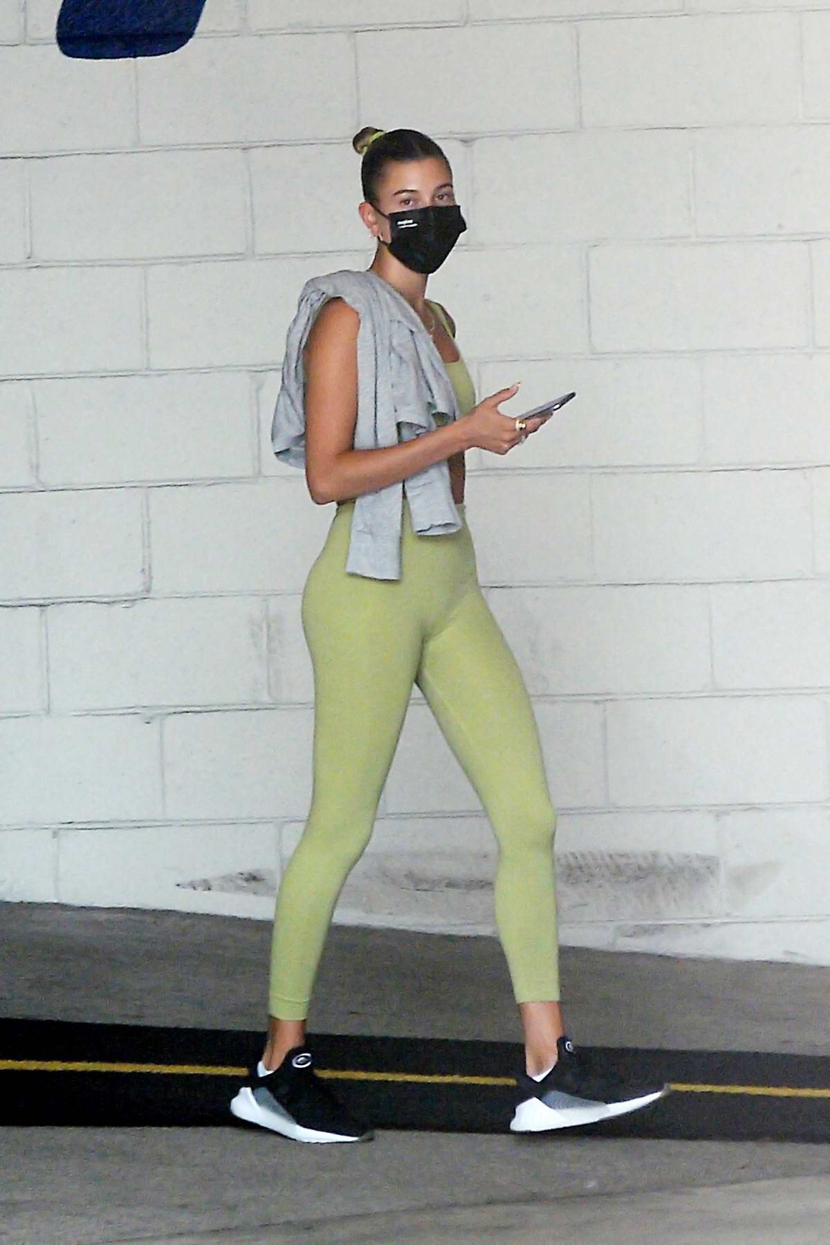 Hailey Bieber sports a green workout top and leggings as she hits the gym  in Los