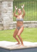 Jessie James Decker sports an animal print bikini as she takes a break during a press day for her cookbok in Nashville, Tennessee
