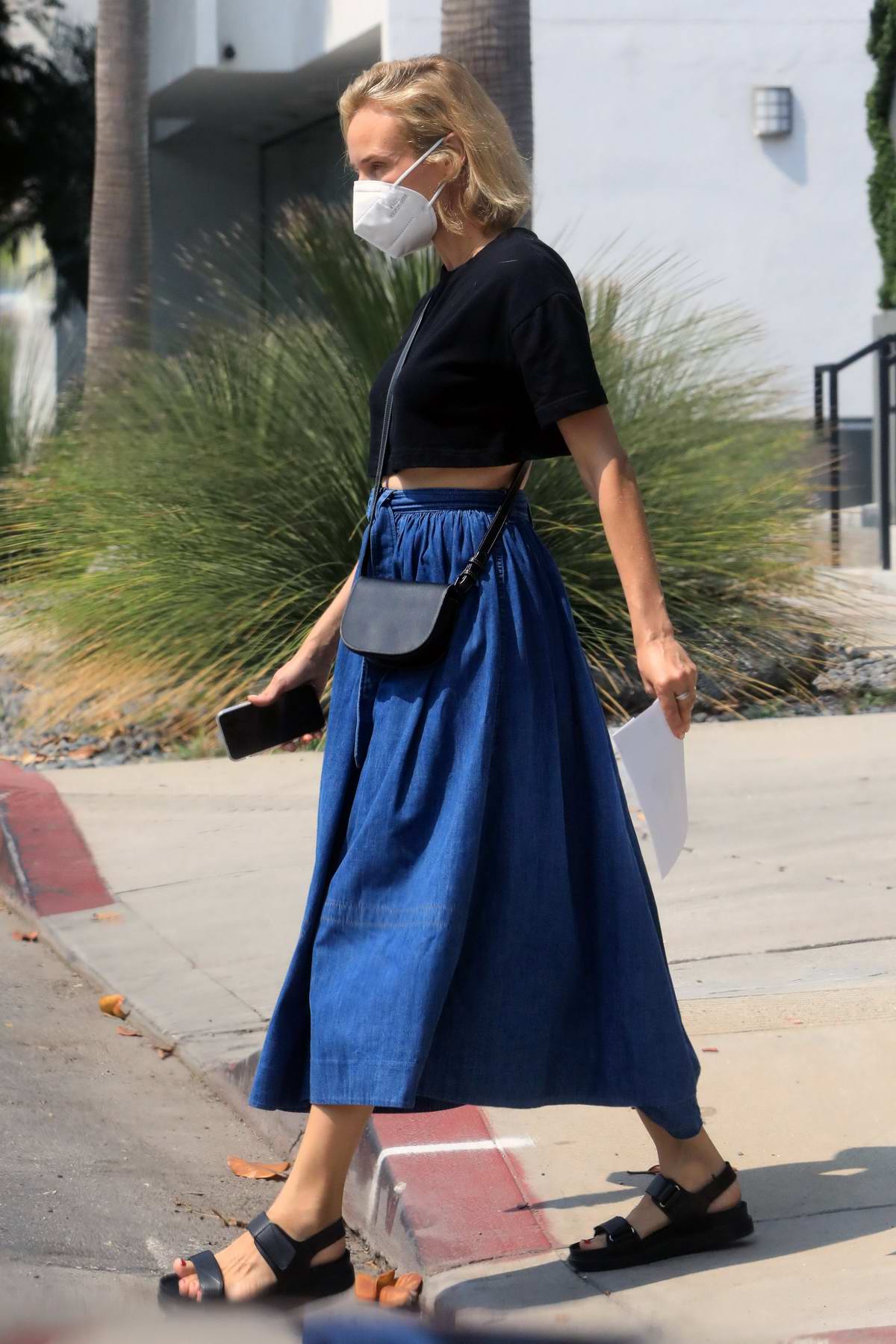 diane kruger wears a black crop top and denim skirt while shopping  groceries at bristol farms in los angeles-160920_7