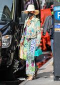 Jennifer Lopez dons a colorful dress as she leaves a building with Alex Rodriguez in New York City