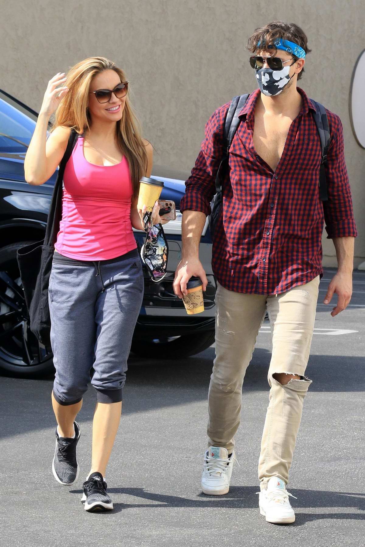 Chrishell Stause wears a hot pink tank top as she arrives at the DWTS  studio in