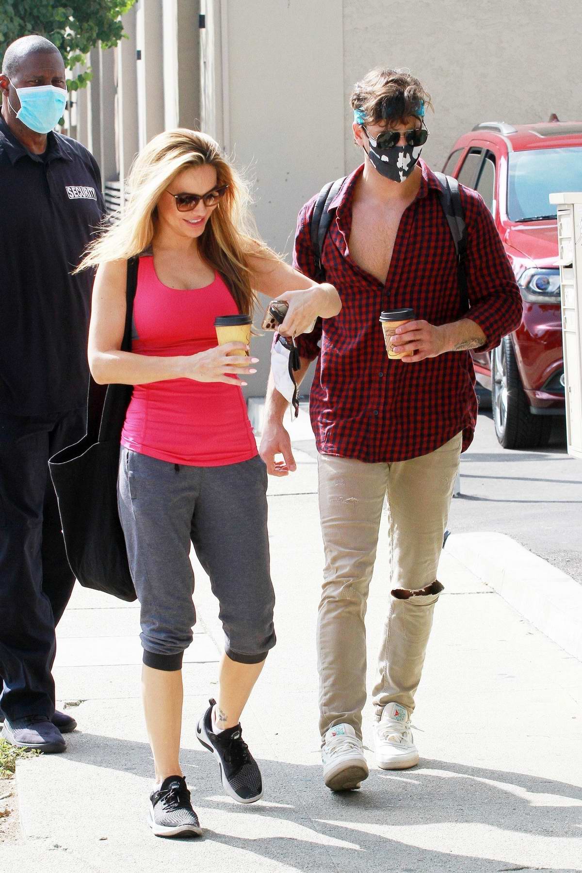 Chrishell Stause wears a hot pink tank top as she arrives at the DWTS  studio in