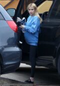 Emma Roberts wears an oversized sweatshirt and leggings while arriving home in Los Feliz, California