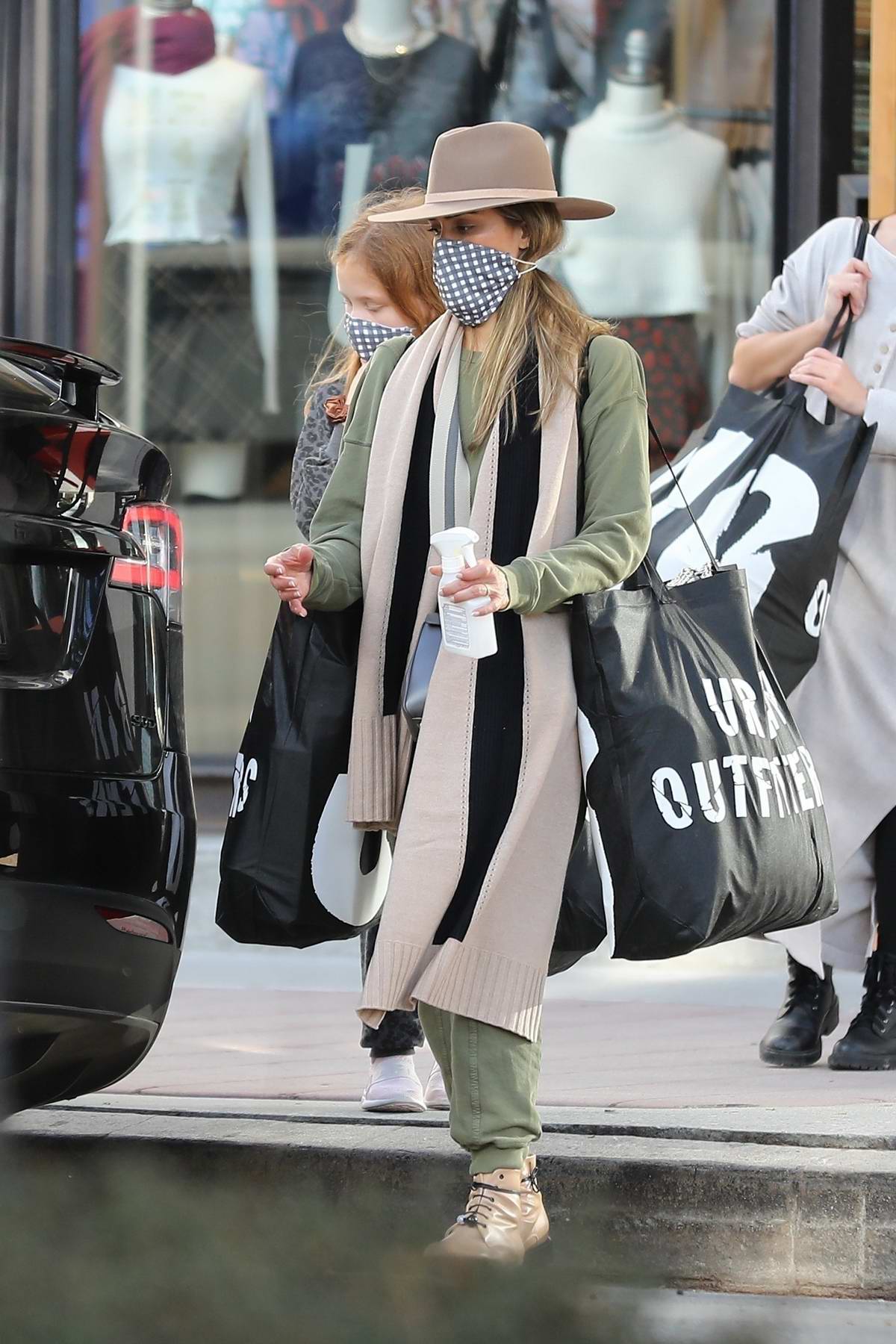 Jessica Alba dons army green ensemble during a shopping trip at