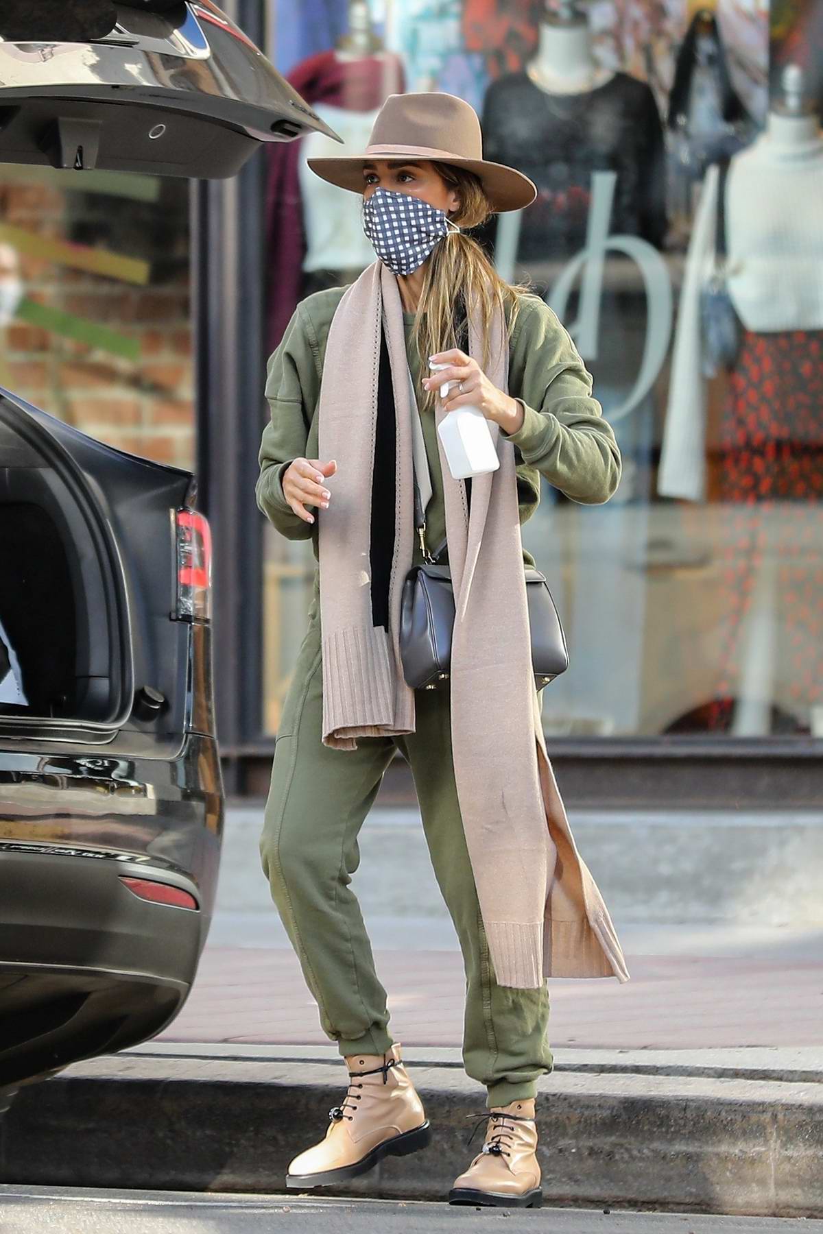 Jessica Alba dons army green ensemble during a shopping trip at