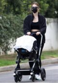 Katherine Schwarzenegger takes her newborn daughter out for a stroll with her mother Maria Shriver in Los Angeles