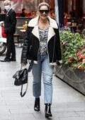 Kelly Brook dons a fur-lined leather jacket and flashes a smile while arriving at Global Radio studios in London, UK