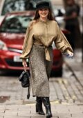Kelly Brook looks stunning in a satin blouse and animal print pleated skirt while arriving at Global Radio in London, UK