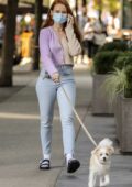 Madelaine Petsch wears two-toned sweater and skinny jeans while out walking her dog in Vancouver, Canada