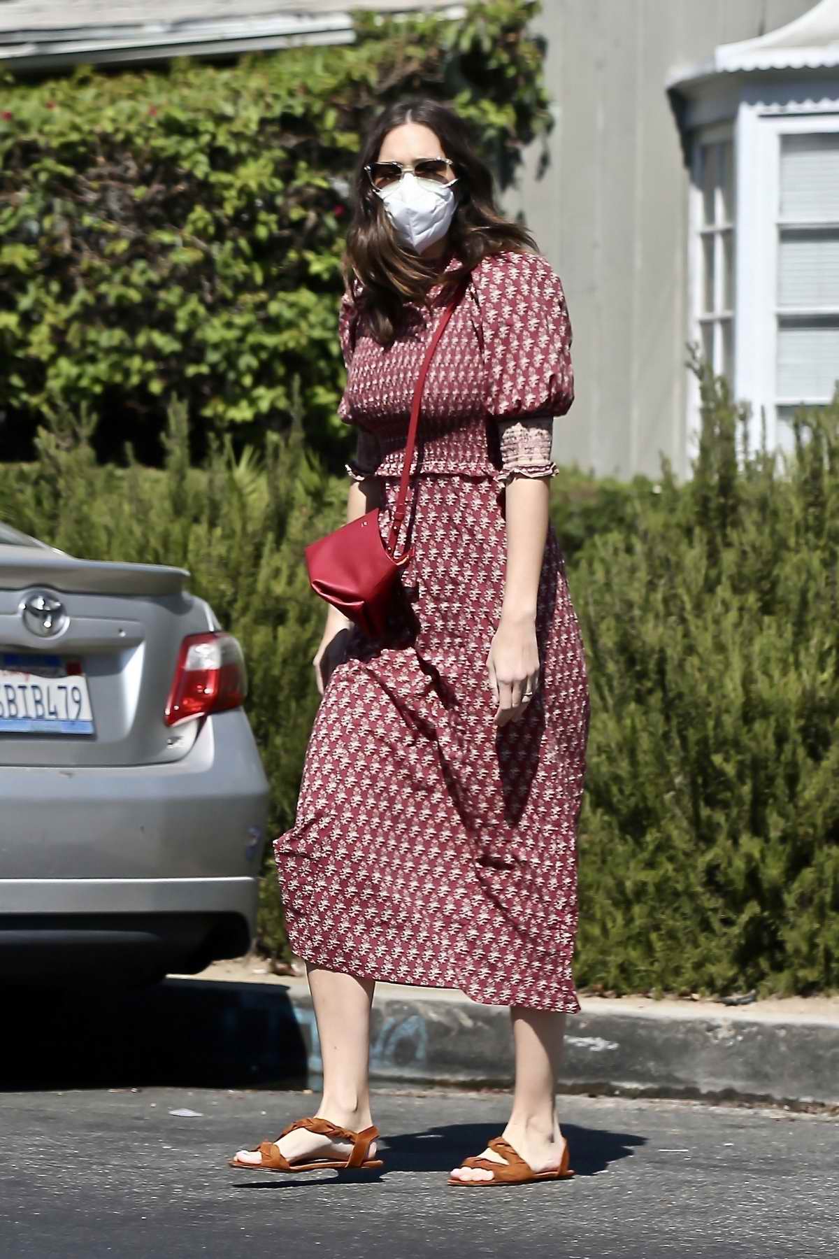 mandy moore shows off her growing baby bump in a printed dress as she ...