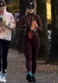 Rita Ora looks great in burgundy leggings with matching top while heading  to the gym with
