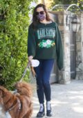 Aubrey Plaza dons green 'Hail Satan' sweatshirt and skinny jeans while walking her dogs in Los Angeles