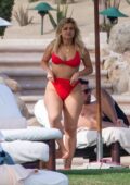 Bebe Rexha looks stunning in a red bikini during a romantic getaway with boyfriend Keyan Safyari in Cabo San Lucas, Mexico