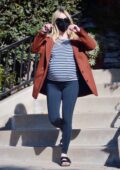 Emma Roberts shows her baby bump in a striped tee and leggings while running some errands in Los Angeles