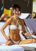 Jocelyn Chew shows off toned physique in a white bikini while enjoying a beach day with friends in Miami, Florida