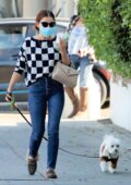 Lucy Hale looks cute in a checkered sweater and skinny jeans while out with her dog Elvis in Los Angeles