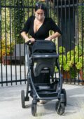 Nikki Bella and Artem Chigvintsev take their son out for a walk while getting their morning coffee in Studio City, California