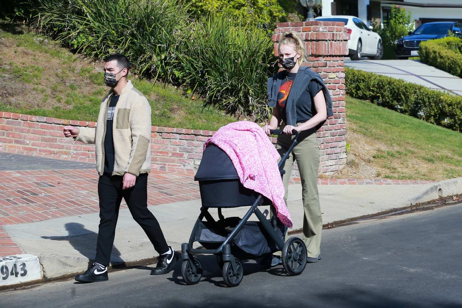 Sophie Turner rocks 70s chic trousers as she and Joe Jonas take baby Willa  out in her stroller