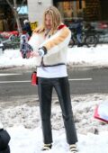 Martha Hunt rocks a fur jacket and leather pants as she poses during a photoshoot in SoHo, New York