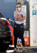 Olivia Wilde seen chatting on her phone while making a stop at a gas station after a solo hike in Los Angeles