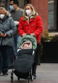 Diane Kruger bundles up in a red jacket and black leather boots for an outing with her mother and her daughter in New York City