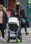 gigi hadid sports a black puffer jacket and leggings while out with her  baby daughter in soho, new york city-110121_7