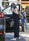 Jennifer Garner waves at the cameras after stopping to check on the progress of her new home in Brentwood, California