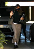 Jennifer Garner waves for the camera as she arrives for a meeting in Brentwood, California