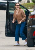 Lily Collins is all smiles as she arrives to deliver a birthday present to a friend's house in Los Angeles