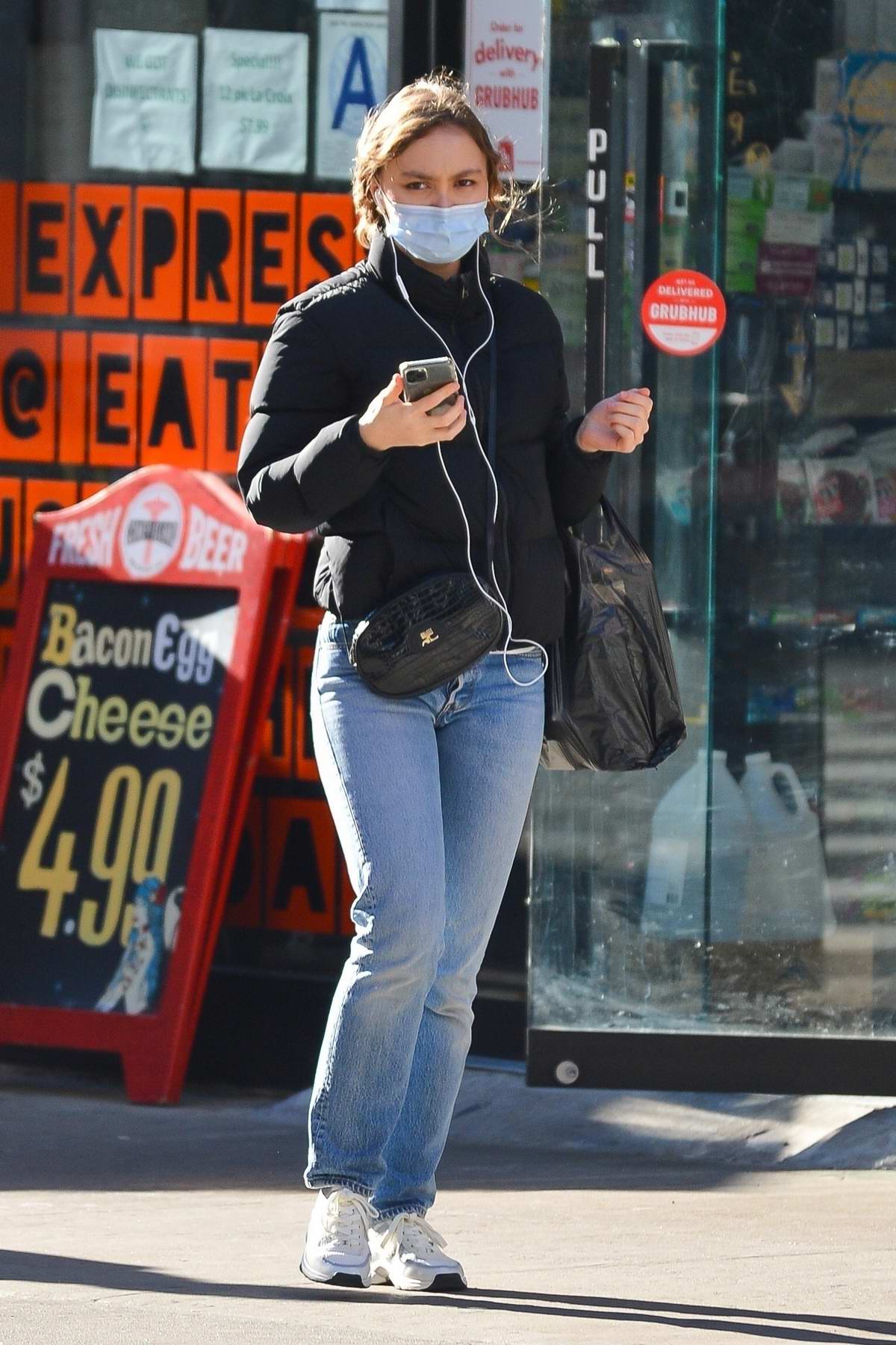 lily-rose depp bundles up in a puffer jacket as she enjoys a stroll in ...