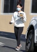 Olivia Munn sports a grey hoodie and black leggings as she heads to a  private gym