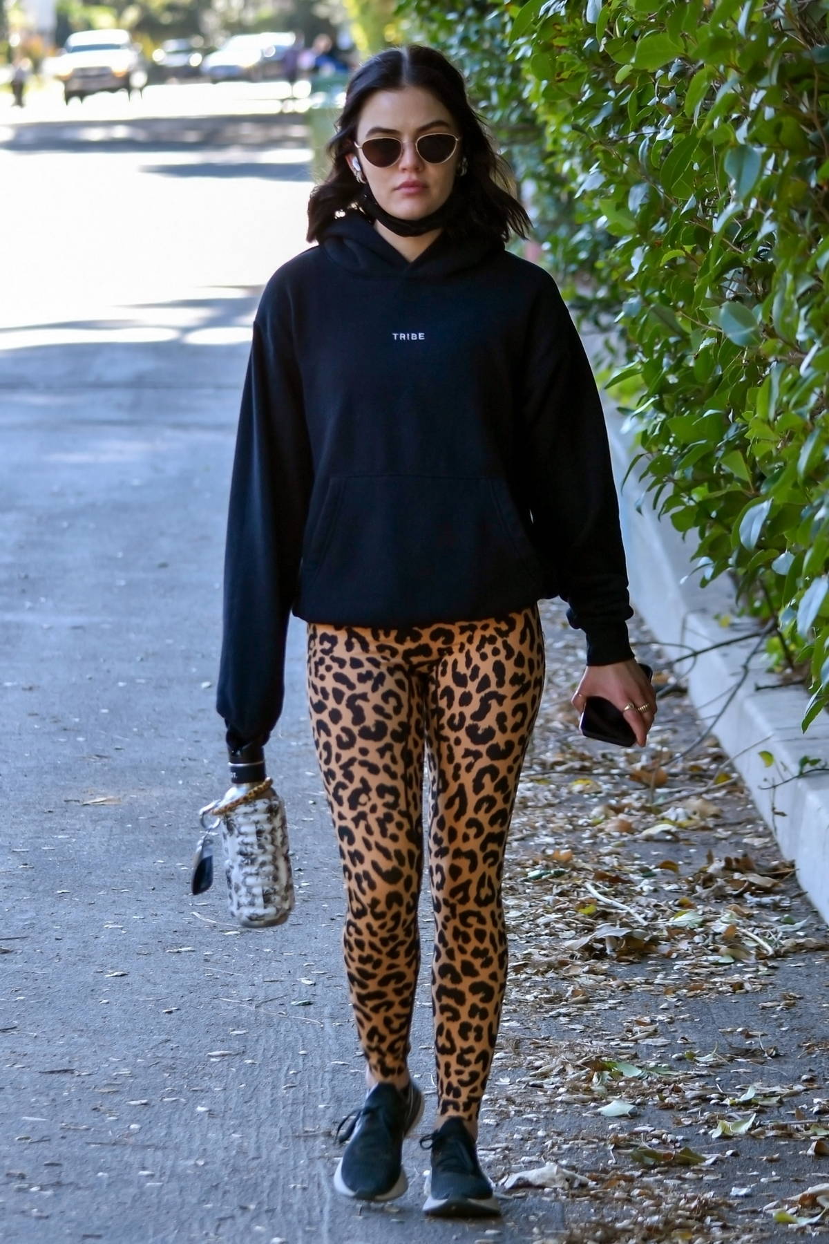 Lucy Hale sports a black hoodie and animal print leggings for a hike  session in Los