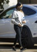 Olivia Munn sports a grey hoodie and black leggings as she heads to a  private gym