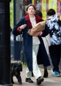 Emma Corrin keeps it casual yet stylish as she steps out for a walk with a friend in London, UK