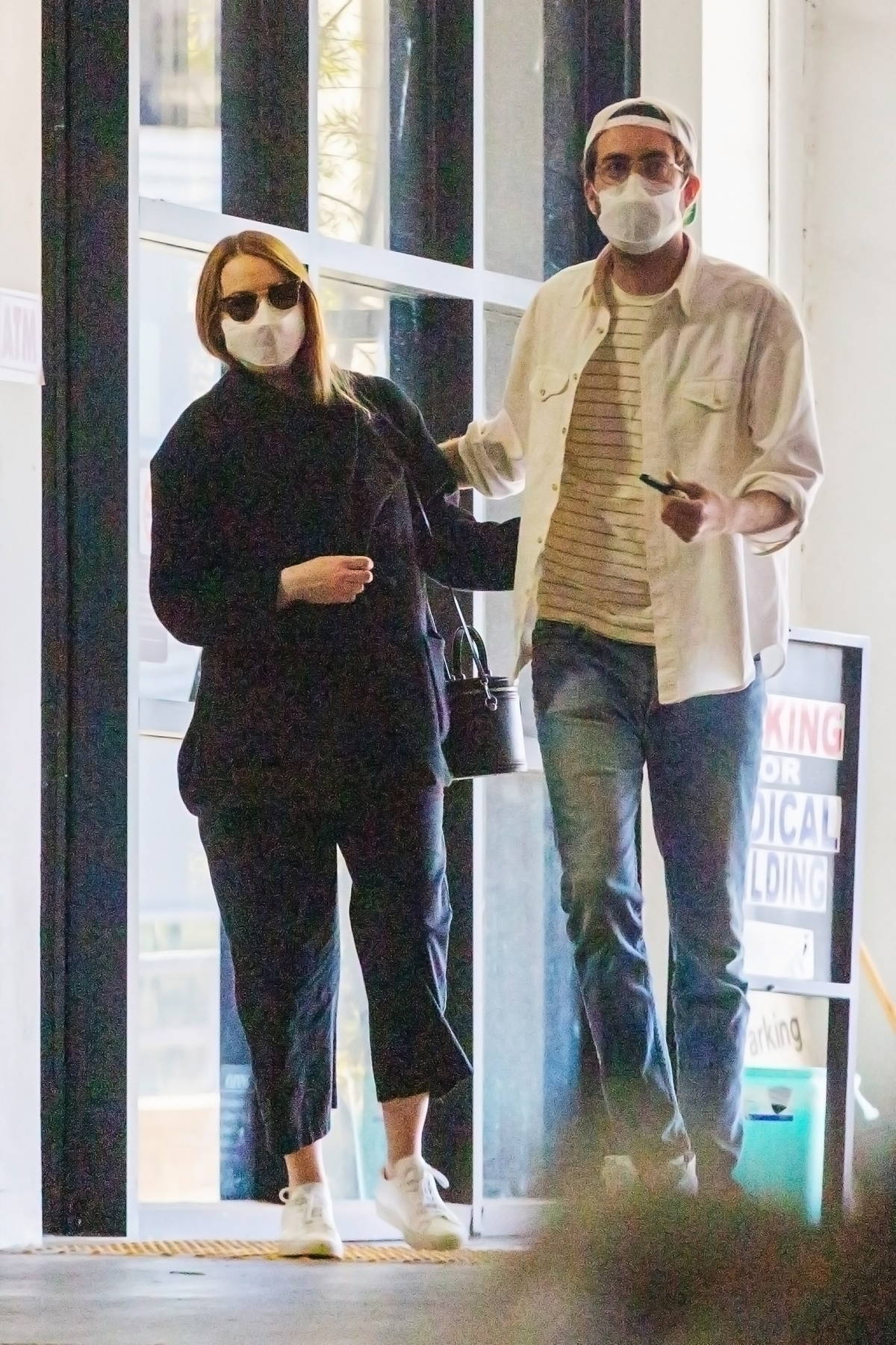 emma stone seen leaving a medical building with husband dave